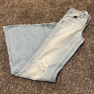 Shyanne ripped bell bottom jeans.